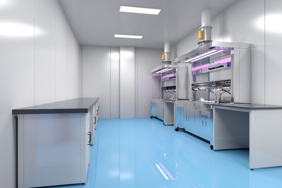 A pathologist using a modern grossing station with integrated downdraft ventilation, bright LED lighting, and stainless steel work surface for safe tissue specimen examination